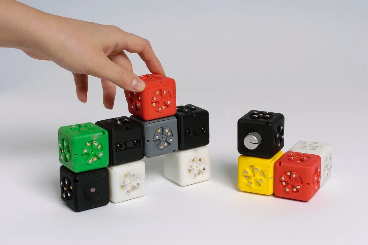 The Cubelets robotic construction kit allows anyone to build simple robots using blocks that magnetically snap together, the overall behavior determined by the interaction between them