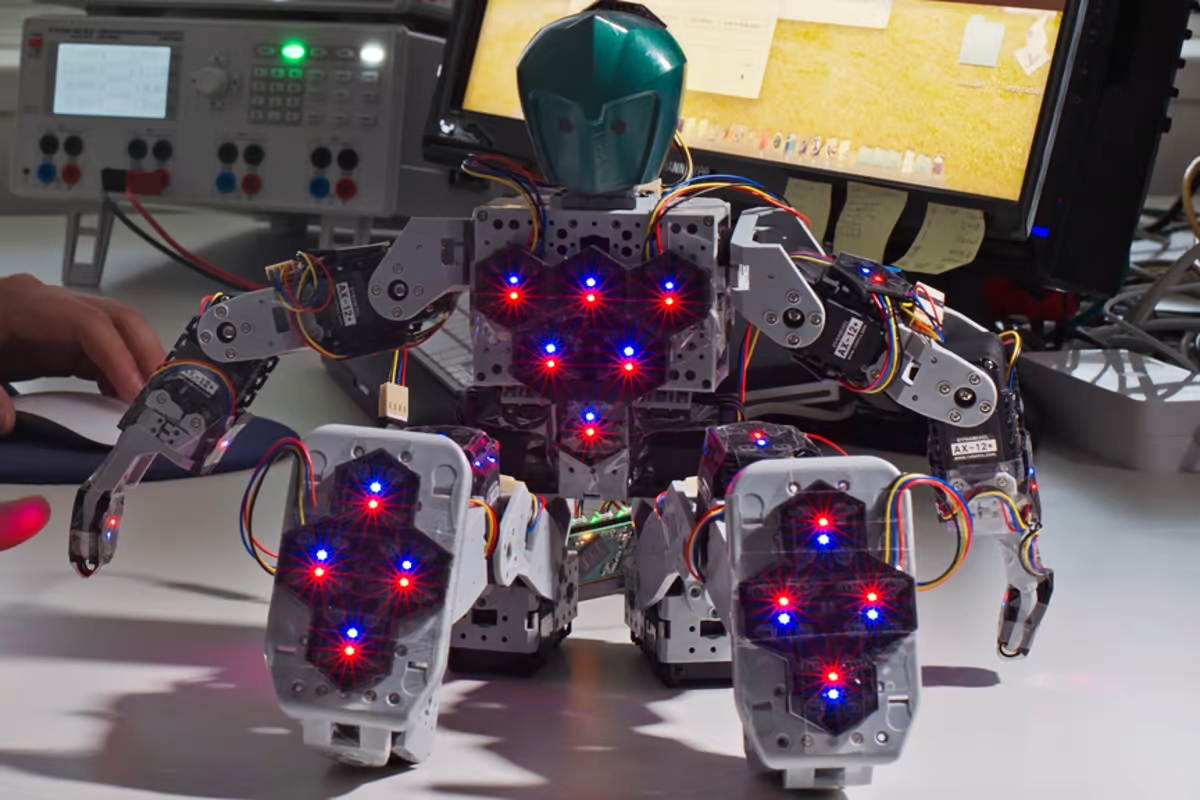 Bioloid Robot with 31 hexagonal sensor modules distributed throughout its body to give it the sense of touch (Image: Andreas Heddergott / TU Munich)