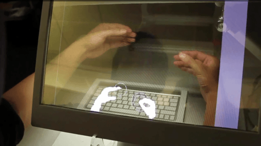 Hand-manipulated objects and transparent displays - the computer desktop of tomorrow?