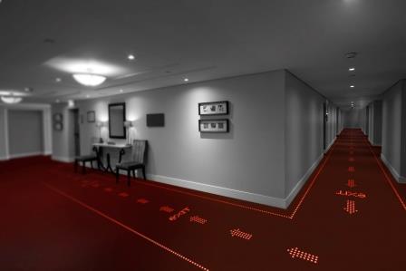 LED light transmissive carpets to provide information, direction, inspiration and safety in offices, hotels and public buildings
