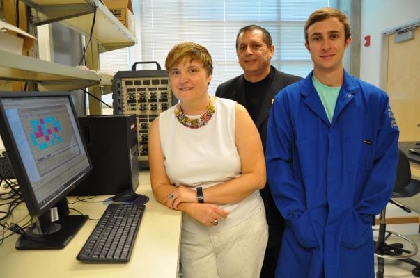 From left, Mihrimah Ozkan, Cengiz Ozkan and Zachary Favors in the Ozkan's lab.
