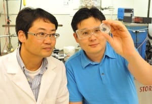 Graduate Student Byeong Wan Kwon (l) and WSU Associate Professor Su Ha inspect a fuel cell.