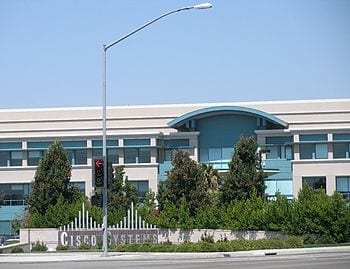 Cisco Systems Building 2 at the San Jose, California main campus. Photographed by user Coolcaesar on August 24, 2006. (Photo credit: Wikipedia)