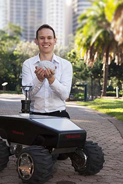 Dr Michael Milford with one of the all-terrain robots to benefit from brain-inspired modelling. 
