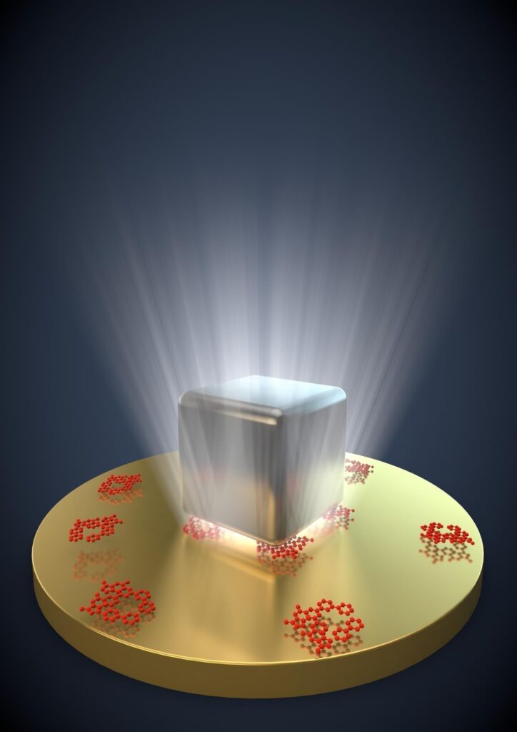 This is an artist's representation of light trapped between a silver nanocube and a thin sheet of gold. When fluorescent molecules -- shown in red -- are trapped between the two, they emit photons up to 1,000 times faster than normal. Credit: Gleb Akselrod, Duke University
