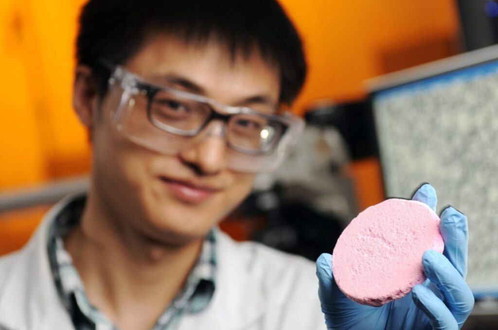 Credit: Gary Meek Yi Zhang, a graduate student co-advised by Prof. Sven Behrens and Prof. Carson Meredith in the School of Chemical & Biomolecular Engineering at Georgia Tech, is shown holding a porous solid material prepared from a capillary foam.