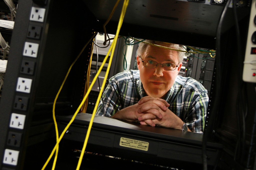 Eric Eide, University of Utah research assistant professor of computer science, stands in the computer science department's "Machine Room" where racks of web servers sit. It is on these computers that Eide, U computer science associate professor John Regehr, and their research team created and tested A3, a suite of computer applications that defeat malware and automatically repair the damage it causes. The project could help lead to better consumer software defenses. Photo Credit: Dan Hixson/University of Utah College of Engineering Photo Credit: Dan Hixson/University of Utah College of Engineering Photo Credit: Dan Hixson/University of Utah College of Engineering Photo Credit: Dan Hixson/University of Utah College of Engineering Photo Credit: Dan Hixson/University of Utah College of Engineering Photo Credit: Dan Hixson/University of Utah College of Engineering Photo Credit: Dan Hixson/University of Utah College of Engineering Photo Credit: Dan Hixson/University of Utah College of Engineering Photo Credit: Dan Hixson/University of Utah College of Engineering Photo Credit: Dan Hixson/University of Utah College of Engineering Photo Credit: Dan Hixson/University of Utah College of Engineering Photo Credit: Dan Hixson/University of Utah College of Engineering Photo Credit: Dan Hixson/University of Utah College of Engineering Photo Credit: Dan Hixson/University of Utah College of Engineering