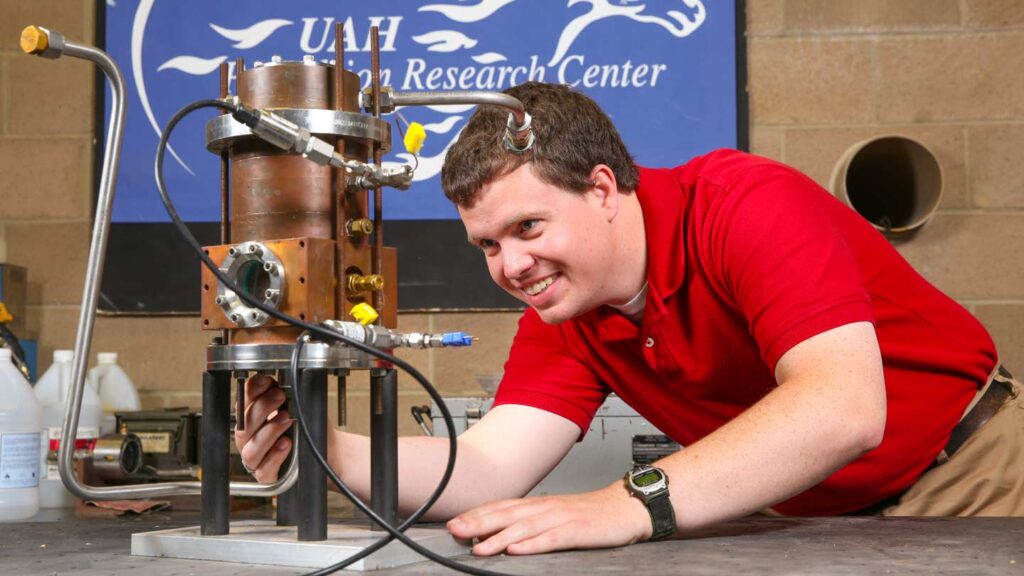 Matthew Hitt, doctoral student in mechanical engineering, is working with a hybrid engine that burns solid and liquid fuels at the same time. His testing is going on in the Johnson Research Center on the UAH campus.