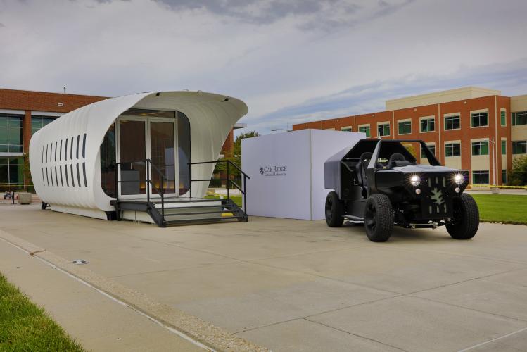 Oak Ridge National Laboratory's Additive Manufacturing Integrated Energy (AMIE) demonstration connects a 3D-printed building and vehicle to showcase a new approach to energy use, storage and consumption. Photo by Carlos Jones 