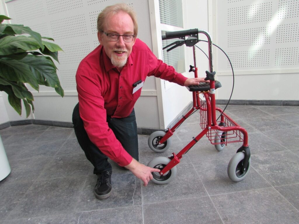 Senior scientist Olli Kuusisto presents the first sensors that have been retrofitted on a rollator.