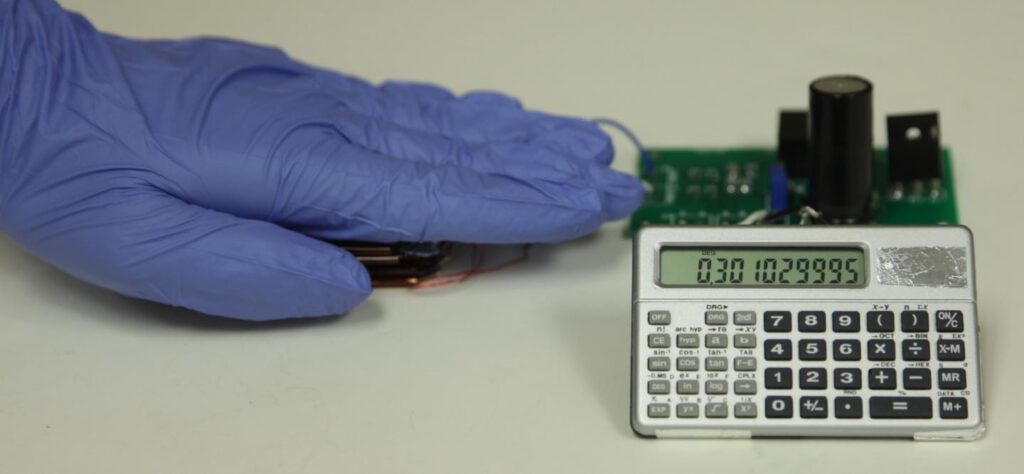 With this triboelectric nanogenerator and two-stage power management and storage system, finger tapping motion generates enough power to operate this scientific calculator. CREDIT Credit: Zhong Lin Wang Laboratory
