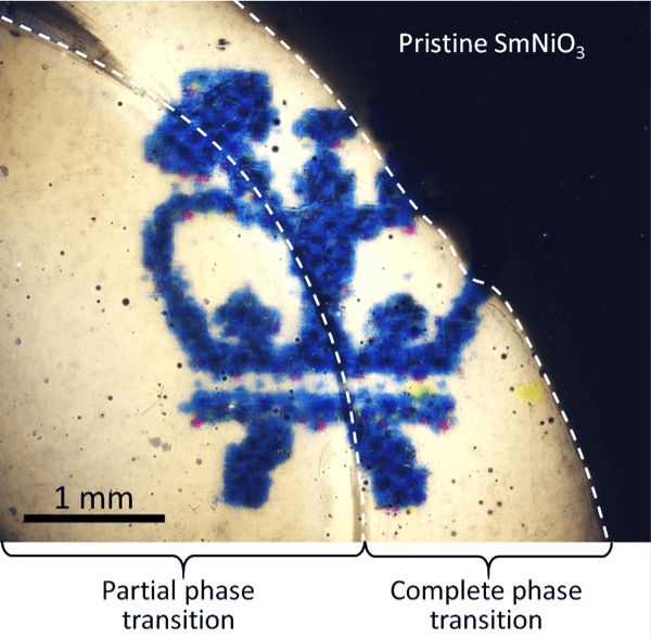 Prototype of a smart window. The picture shows a layer of phase-transition material SmNiO3 placed on top of a Columbia Engineering School logo. The transparency of the material can be controlled by electron doping under ambient conditions. Pristine SmNiO3 is opaque; partial phase-transition makes the material translucent, and complete phase-transition makes it transparent.