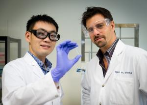 Dr Terry Steele (right) and his student Gao Feng have developed a glue that hardens in response to a small electric current. Credit: Nanyang Technological University