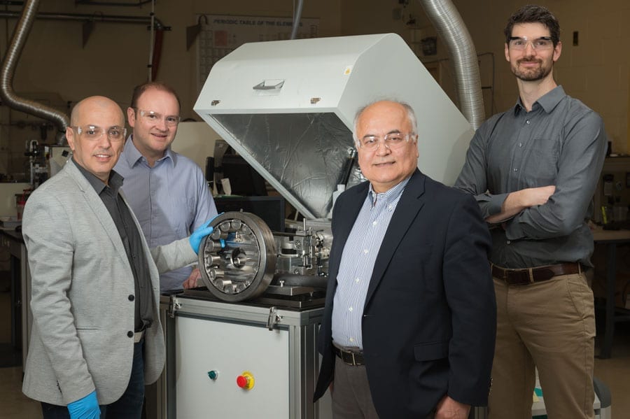 Researchers from Argonne’s Surface and Lubrication Interaction, Discovery and Engineering initiative developed a novel “diamond-like” coating that could prove of great benefit when used to coat equipment for wind turbines, like the bearing in this photo. Pictured from left, Levent Eryilmaz, Giovanni Ramirez, Ali Erdemir and Aaron Greco.