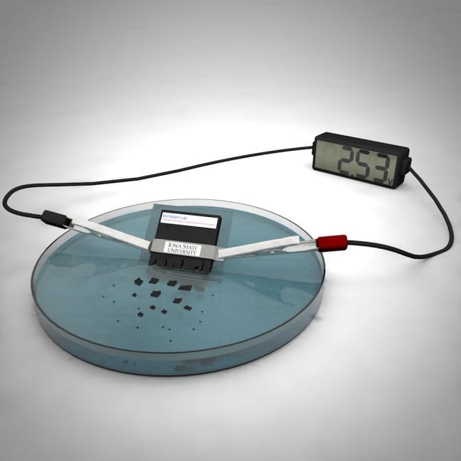 Iowa State scientists have developed a working battery that dissolves and disperses in water. Larger image. Scientific illustration by Ashley Christopherson.