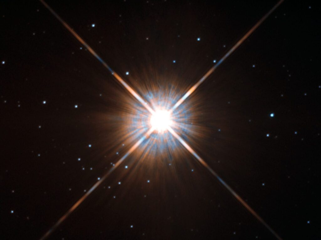 Shining brightly in this Hubble image is our closest stellar neighbour: Proxima Centauri. Proxima Centauri lies in the constellation of Centaurus (The Centaur), just over four light-years from Earth. via en.wikipedia.org