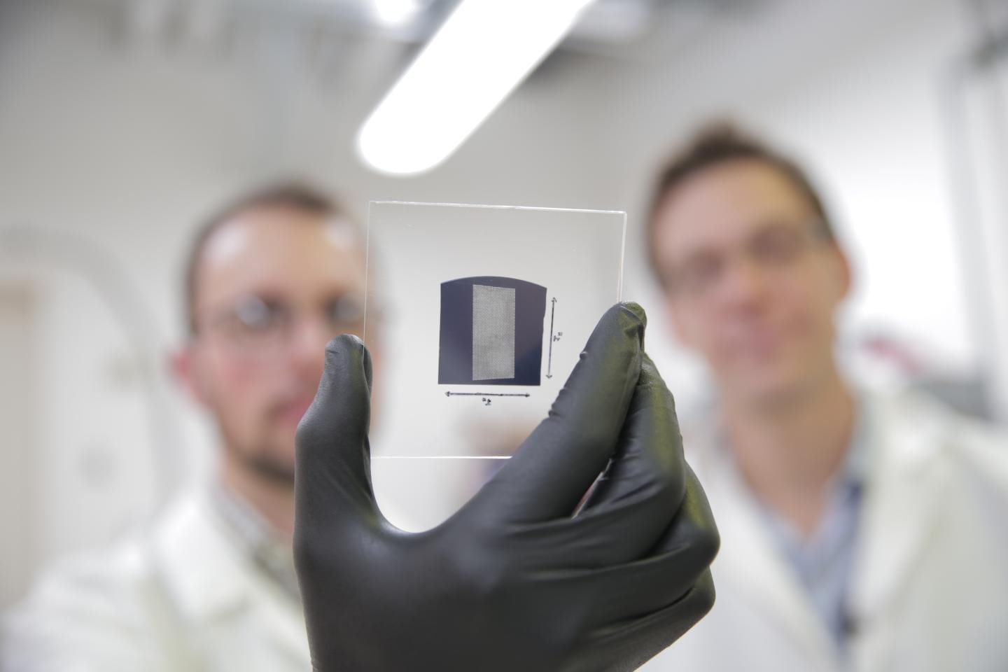The UW-Madison engineers use a solution process to deposit aligned arrays of carbon nanotubes onto 1 inch by 1 inch substrates. The researchers used their scalable and rapid deposition process to coat the entire surface of this substrate with aligned carbon nanotubes in less than 5 minutes. The team's breakthrough could pave the way for carbon nanotube transistors to replace silicon transistors, and is particularly promising for wireless communications technologies. CREDIT Stephanie Precourt