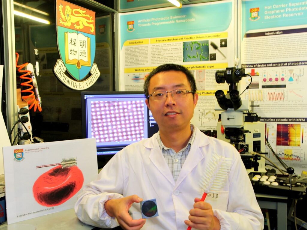 Dr Tang Yinyao showing the disc which contains millions of synthetic light-seeking nanorobots