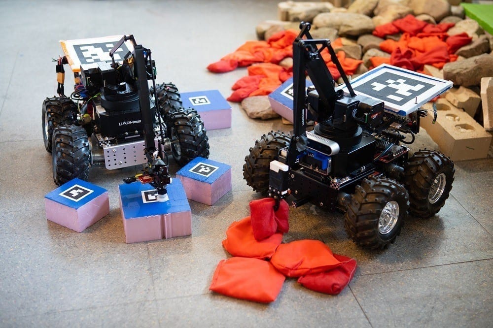 Robot vehicle uses surroundings to build complex structures and overcome obstacles
