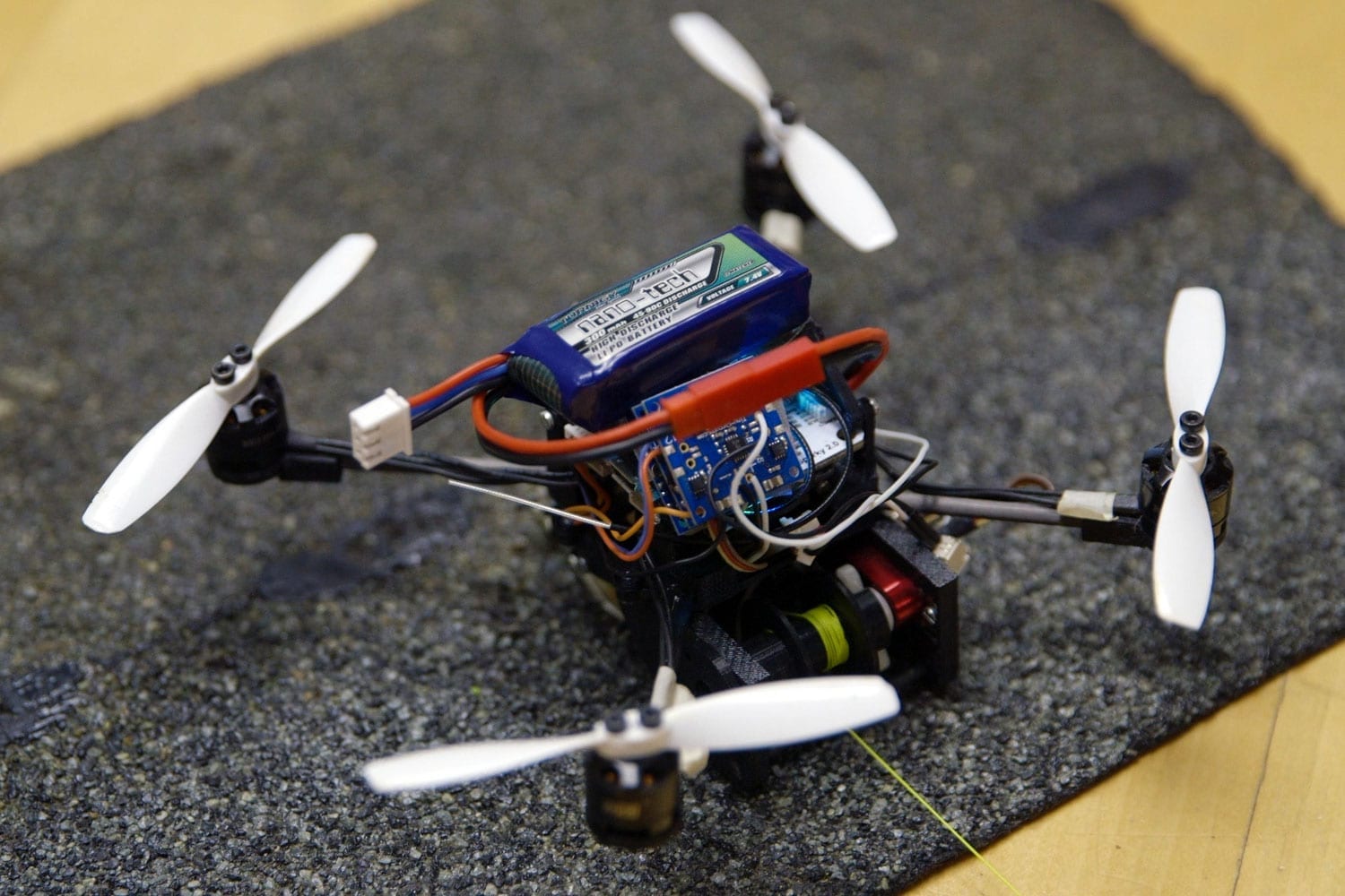 Small flying robots can perch and move objects 40 times their weight