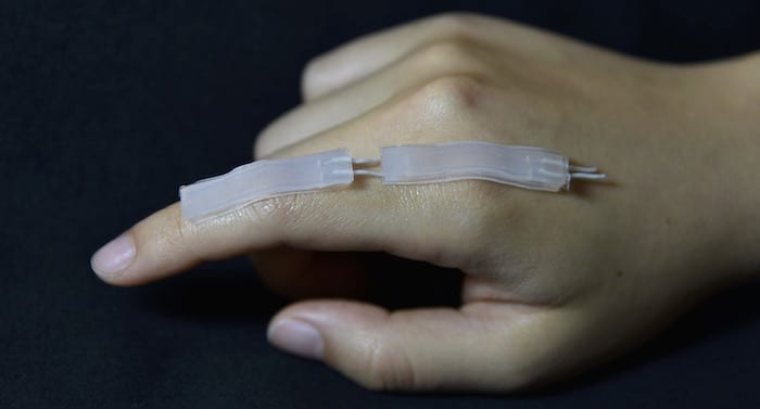 A wearable safe sensor for use in diagnostics, therapeutics, human-computer interfaces, and virtual reality