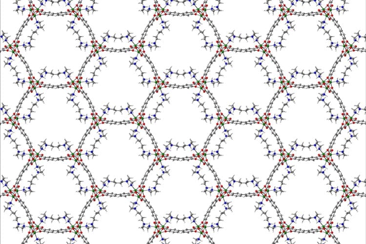 Metal-organic frameworks are highly porous, making them ideal for absorbing gases and liquids. This graphic shows the interior of a MOF based on the metal magnesium (green balls), and has added molecules — tetraamines (blue & gray) — added to the pores to more efficiently absorb carbon dioxide from power plant emissions. (UC Berkeley graphic by Eugene Kim)