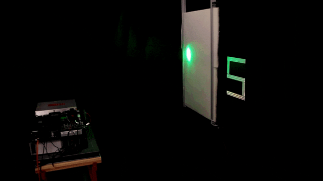 The laser scanning process in action. Single photons that travel through the foam, bounce off the “S,” and back through the foam to the detector provide information for the algorithm’s reconstruction of the hidden object. (Image credit: Stanford Computational Imaging Lab)