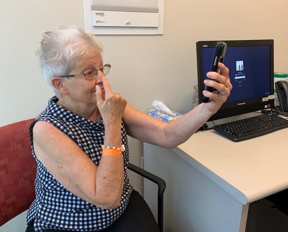 Kathryn Atkinson, a patient at Houston Methodist Hospital, participates in a smartphone screening test to analyze stroke-like symptoms she's experiencing. The test is powered by a machine learning algorithm developed by researchers at Penn State's College of Information Sciences and Technology and Houston Methodist Hospital, which could significantly reduce the amount of time it takes physicians to diagnose a stroke.  IMAGE: HOUSTON METHODIST HOSPITAL