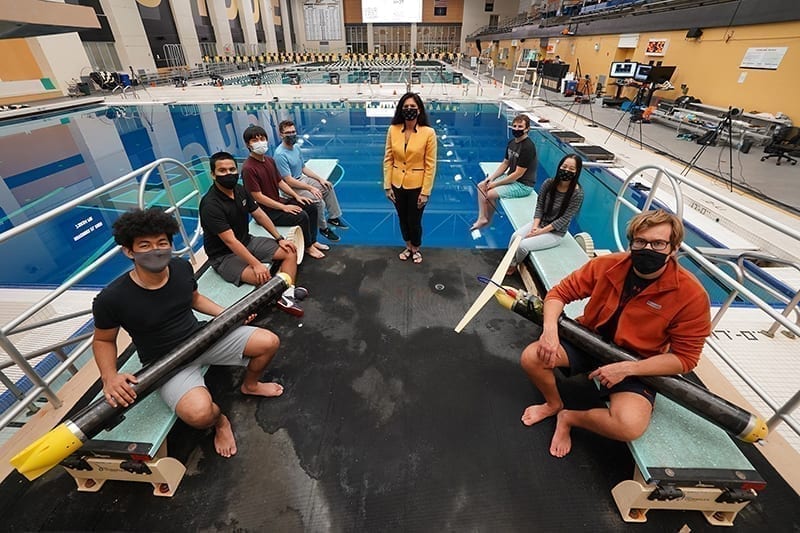 Nina Mahmoudian (center) and her students have developed an underwater glider that can operate silently in confined spaces, ideal for conducting biology or climate studies without disturbing wildlife. (Purdue University photo/Jared Pike)