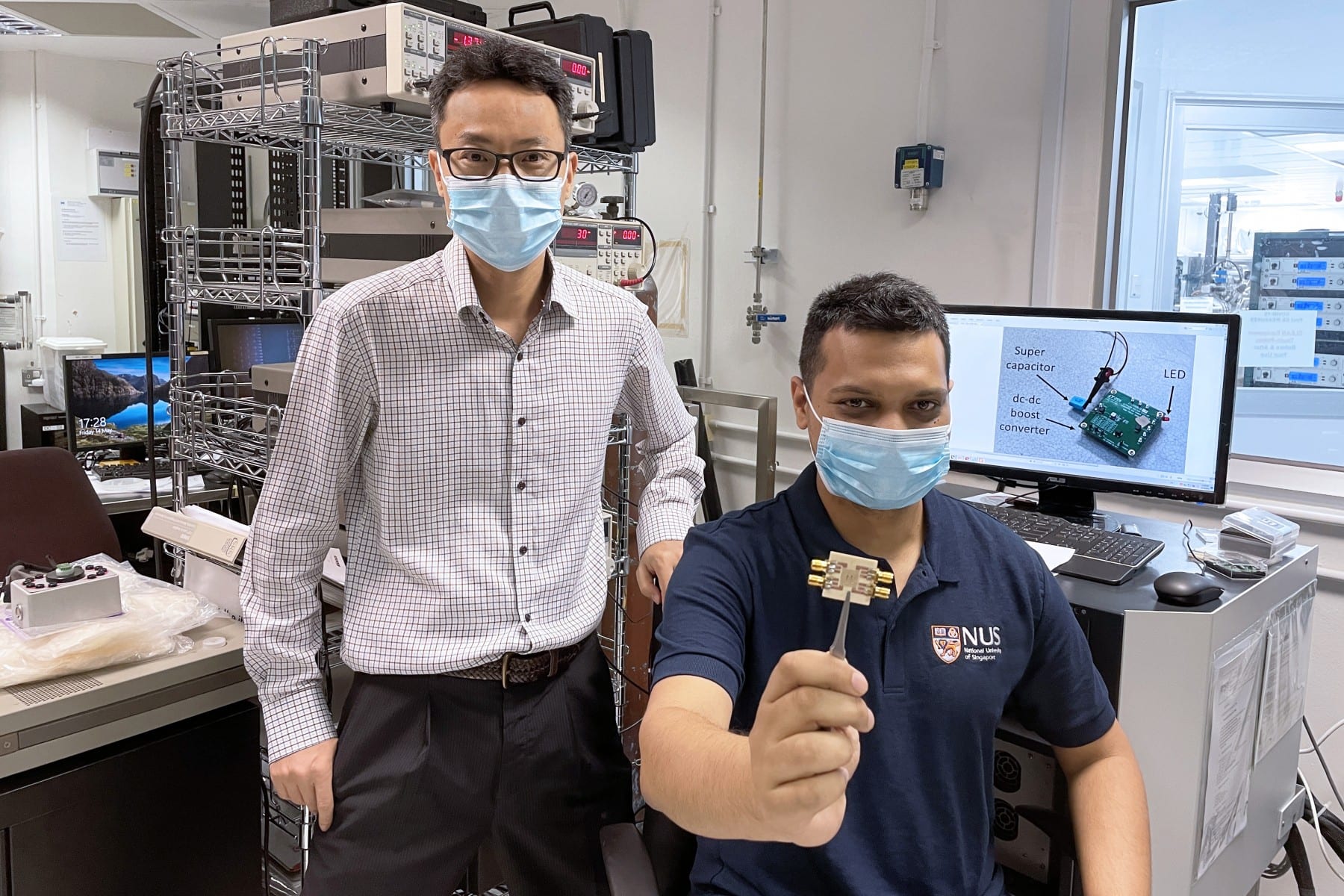 The research breakthrough was achieved by a team led by Professor Yang Hyunsoo (left). Dr Raghav Sharma (right), the first author of the paper, is holding a chip embedded with about 50 spin-torque oscillators.