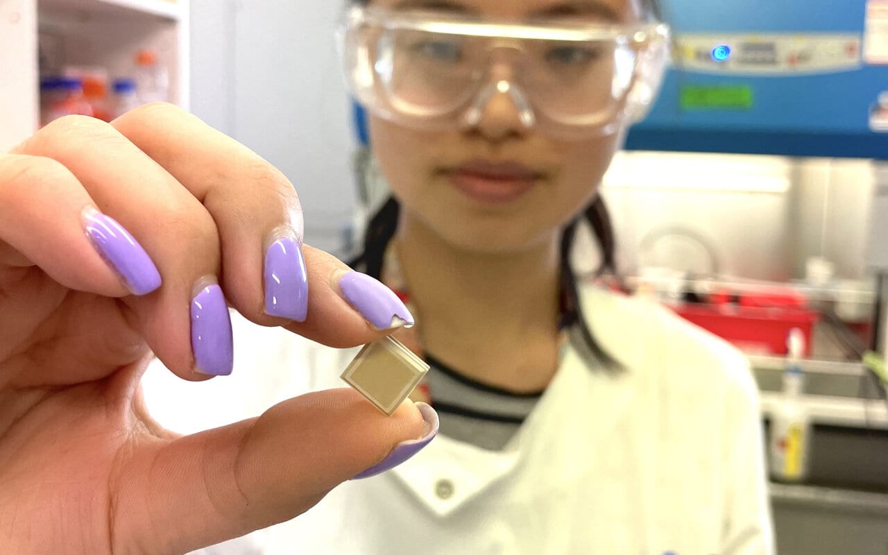 UQ PhD candidate Jovin Choo holding a high-density microarray patch, which could help vaccinate for dengue in a single click.