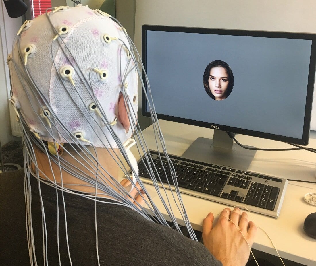 In the experiment, participants were shown images of human faces while having EEG electrodes on the heads.