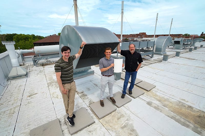 Using 100% outdoor air in an HVAC system is safer, but much more costly and energy intensive. Purdue University engineers (left to right) David Warsinger, Andrew Fix, and James Braun are working on an energy-efficient system that uses membranes to dehumidify outdoor air before it enters the HVAC system. (Purdue University photo/Jared Pike)