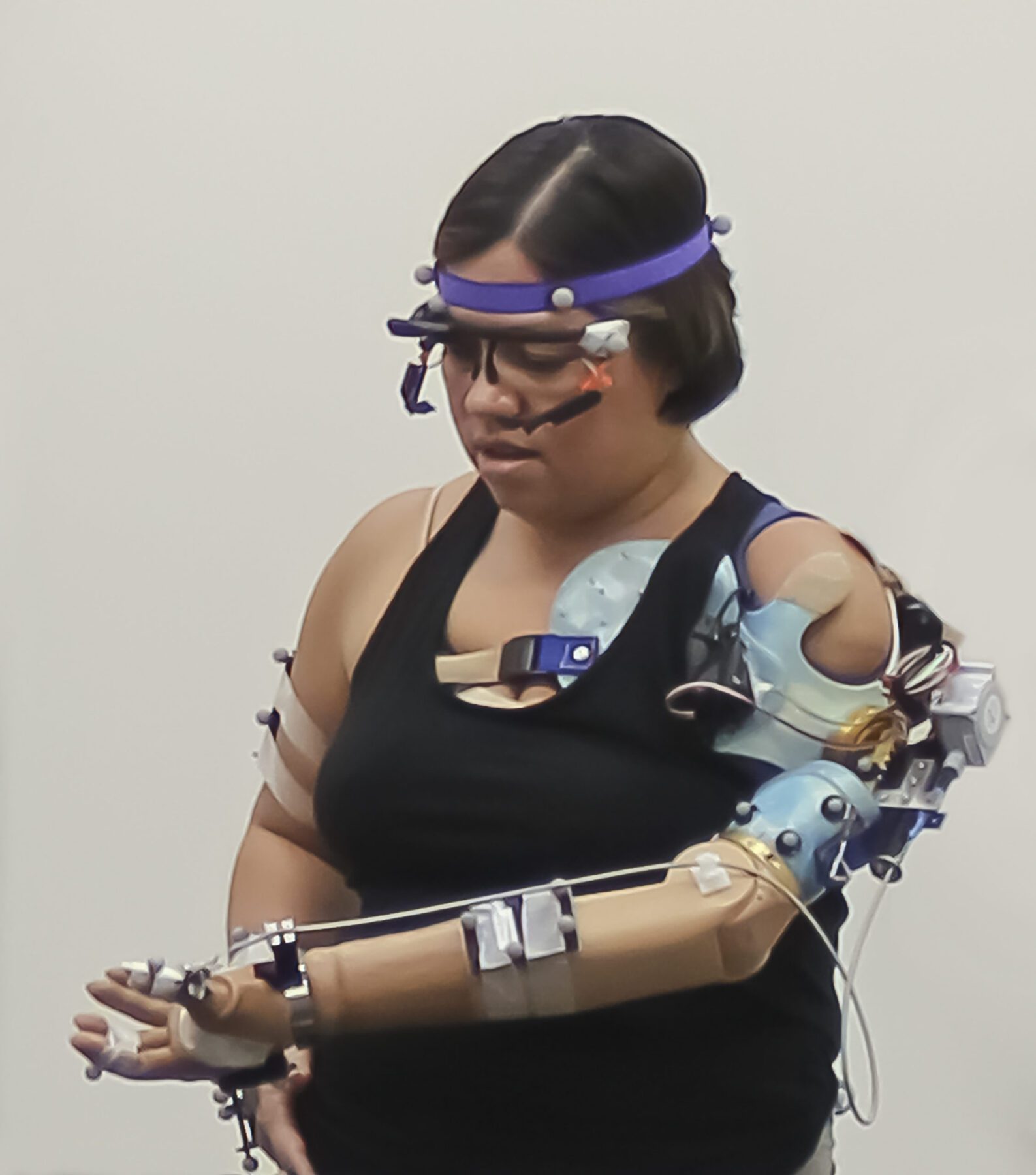 The advanced prosthetic arm feels grip movement sensation, touch on the fingertips, and is controlled intuitively by thinking. Reflective markers on users’ arms and body help a computer see their movements in a 3D-environment, while glasses allow a computer to see exactly what they see.