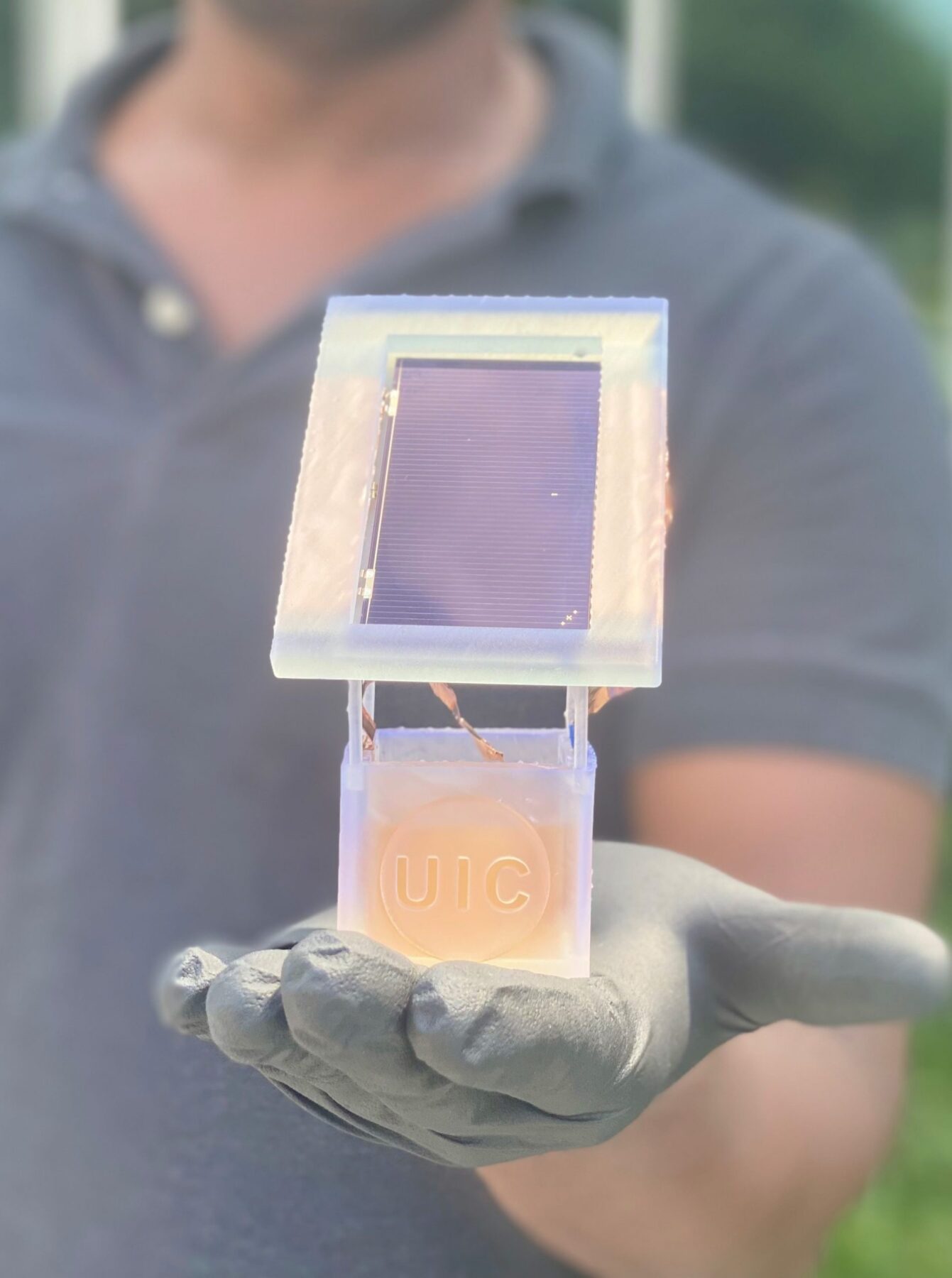UIC researchers create a sustainable electrochemical system in which a solar cell is attached to a well holding a liquid solution. When charged, nitrates from wastewater in the liquid solution are converted to ammonia. (Photo: Meenesh Singh/UIC)