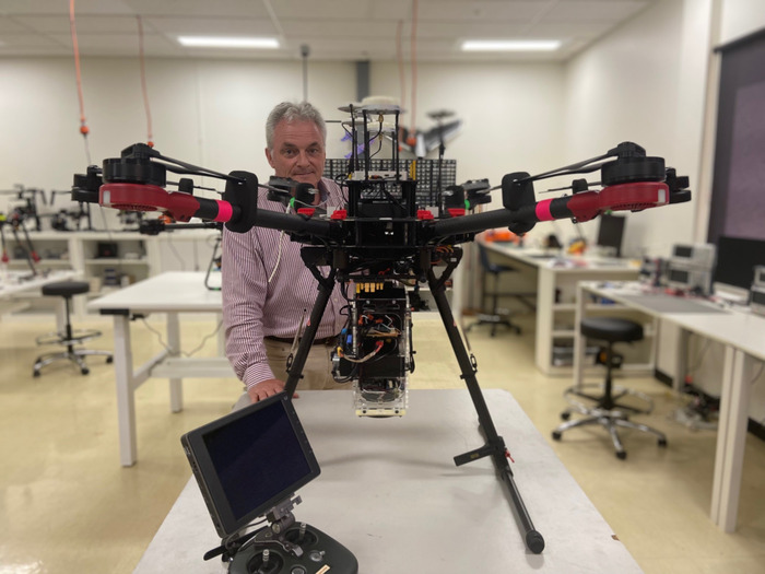 UniSA Professor Anthony Finn pictured with A DJI Matrice 600 drone with a payload capable of emitting or receiving acoustic signals. CREDIT University of South Australia