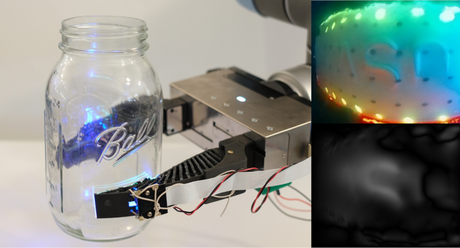 The GelSight Fin Ray gripper holds a glass Mason jar with its tactile sensing. Photo courtesy of MIT CSAIL.