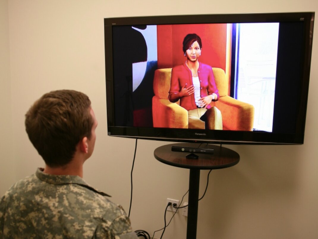 A study participant is interviewed by Ellie, an artificial character, to gather text data. CREDIT Photo courtesy of Jonathan Gratch, USC Institute for Creative Technologies