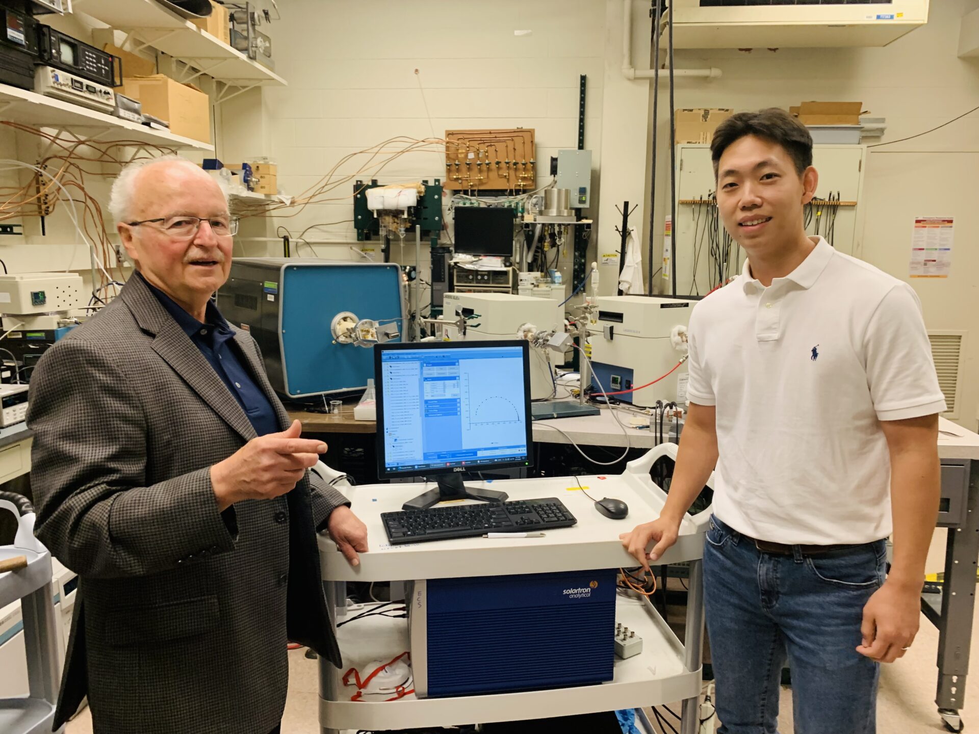 Harry Tuller and postdoctoral fellow Han Gil Seo in the Materials Research Laboratory. The two and colleagues report a simple way to significantly increase the lifetimes of fuel cells and other key devices. Photo: Hendrik Wulfmeier
